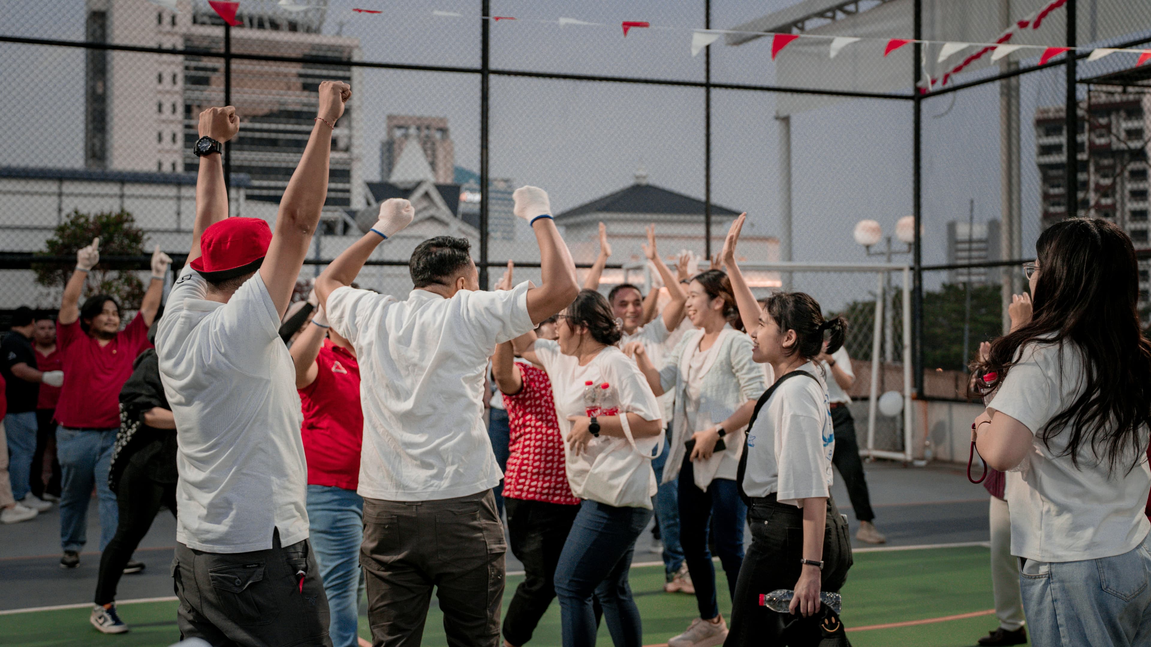 A group of people celebrating with raised arms
